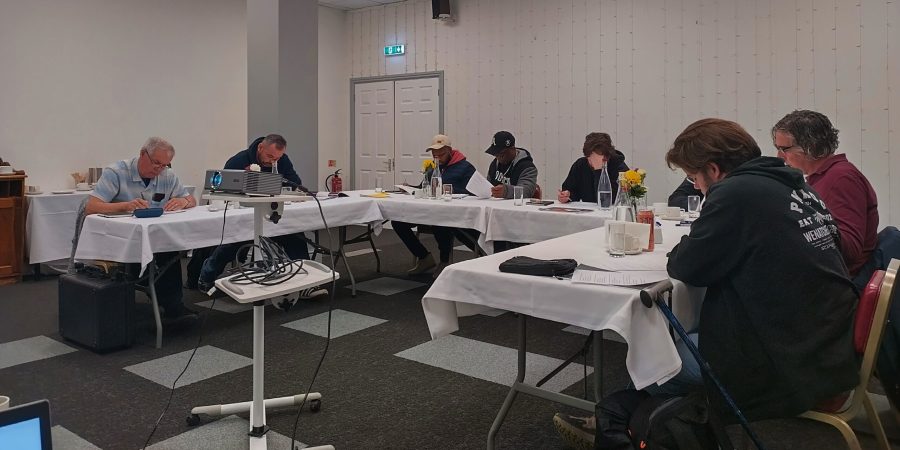 Learners completing written work during a PAT testing course at Bird Hills Golf Centre near Reading and Slough